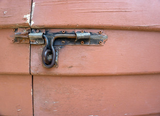 an old wood door with metal handle