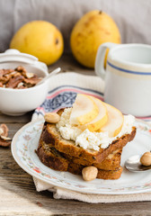 toast for breakfast with sweet cream cheese and pear, a cup of c