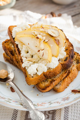 toast for breakfast with sweet cream cheese and pear, a cup of c
