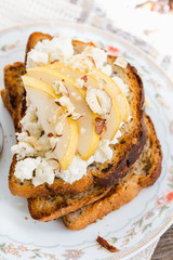 toast for breakfast with cream cheese and sweet pear, nuts