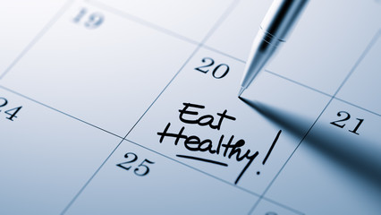 Closeup of a personal agenda setting an important date written w