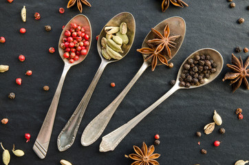 Set of spices on metal spoons