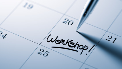 Closeup of a personal agenda setting an important date written w