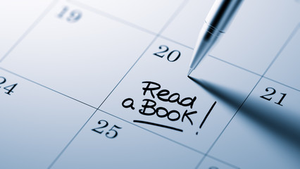 Closeup of a personal agenda setting an important date written w