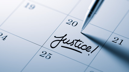 Closeup of a personal agenda setting an important date written w