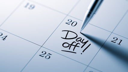 Closeup of a personal agenda setting an important date written w