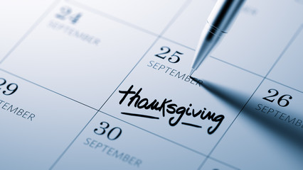 Closeup of a personal agenda setting an important date written w