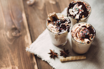 Latte with whipped cream and chocolate, copy space