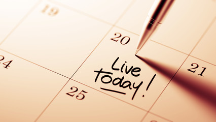 Closeup of a personal agenda setting an important date written w