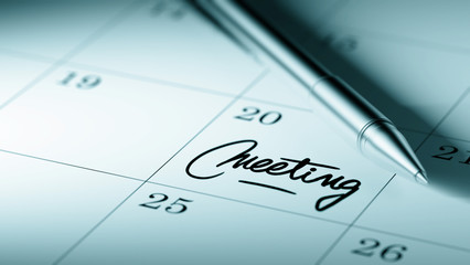 Closeup of a personal agenda setting an important date written w