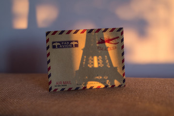 Empty vintage card with statuette of Eiffel Tower