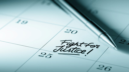 Closeup of a personal agenda setting an important date written w