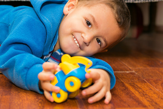 Boy Lying Down Playing