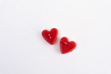 two heart red candles isolated on white background, valentine gr