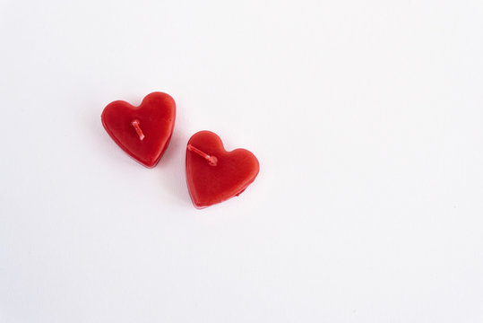 two heart red candles isolated on white background, valentine gr