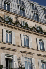 Fototapeta na wymiar Facade on Paris Building Prepared for Christmas
