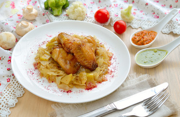 Chicken wings with stewed cabbage