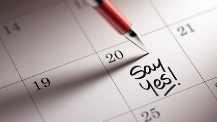 Closeup of a personal agenda setting an important date written w