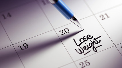 Closeup of a personal agenda setting an important date written w