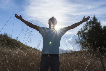 Man praying outdoors