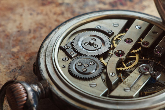 Close-up view of a silver pocket watch.