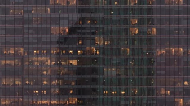Time lapse of employees populating offices till late in the evening