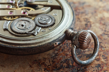 Close-up view of a silver pocket watch.