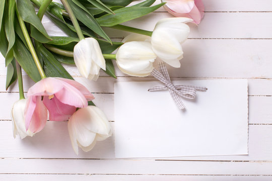 Background with white and pink flowers and empty tag