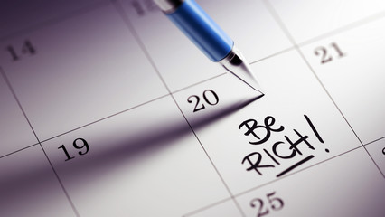 Closeup of a personal agenda setting an important date written w