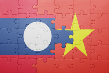 puzzle with the national flag of laos and vietnam