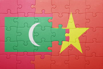 puzzle with the national flag of maldives and vietnam