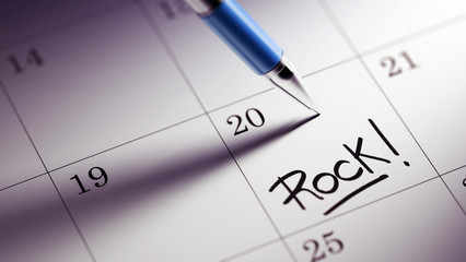 Closeup of a personal agenda setting an important date written w