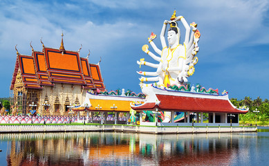 Thailand landmark in koh Samui. Shiva sculpture and Buddhist temple