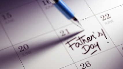 Closeup of a personal agenda setting an important date written w