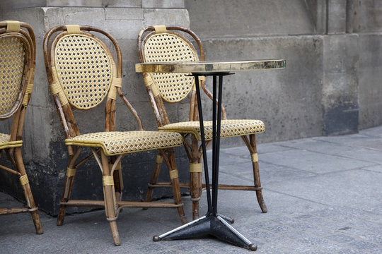 Two Cafe Chairs on a Terrace in Paris, France