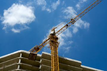 Construction crane against the blue sky