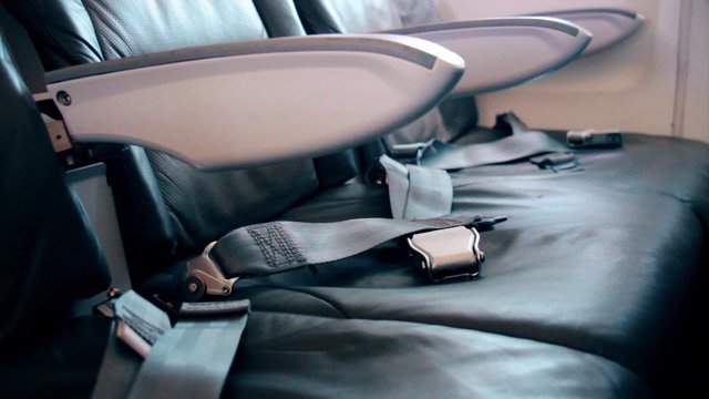seat belts lie on seats in the old plane economy class