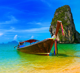 Thai wooden boat on exotic tropical location near Phuket island