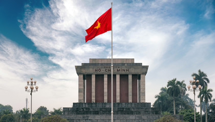 Ho Chi Minh mausoleum in Hanoi with red communistic flag