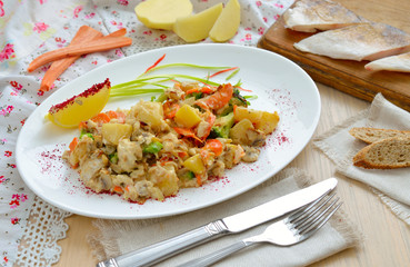 Potatoes with fish and mushrooms