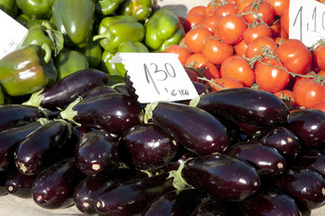Eggplants, Tomatoes and Peppers for sale on market stall in Mallorca, Spain