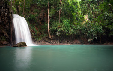Fototapeta na wymiar Peaceful nature background of waterfall in forest