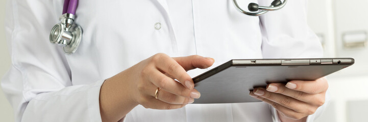 Female Doctor Holding Tablet PC