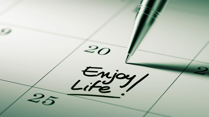 Closeup of a personal agenda setting an important date written w