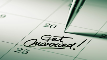 Closeup of a personal agenda setting an important date written w