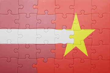 puzzle with the national flag of latvia and vietnam