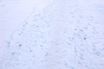 Traces of the recent past a man on the snow.