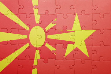 puzzle with the national flag of macedonia and vietnam