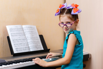 baby girl playing the piano