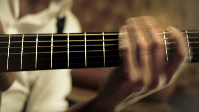 Young man is singing while is playing a guitar  dolly  